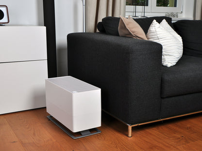 Stadler Form Oskar big humidifier in white next to a couch